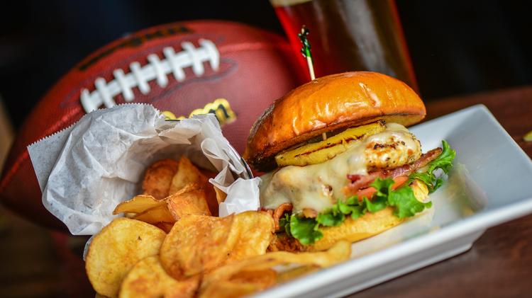 football with burger from cold beers and cheeseburgers sports bar